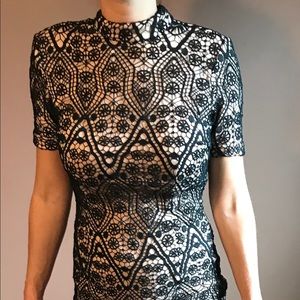 Mid neck, semi backless dress.